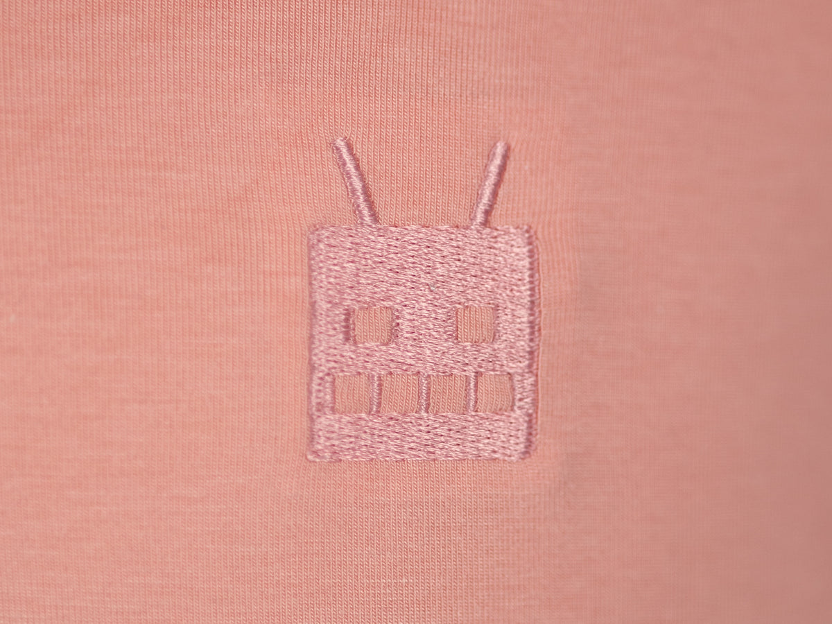 Robot Golf Pink Pony Club polo, lifestyle view.
