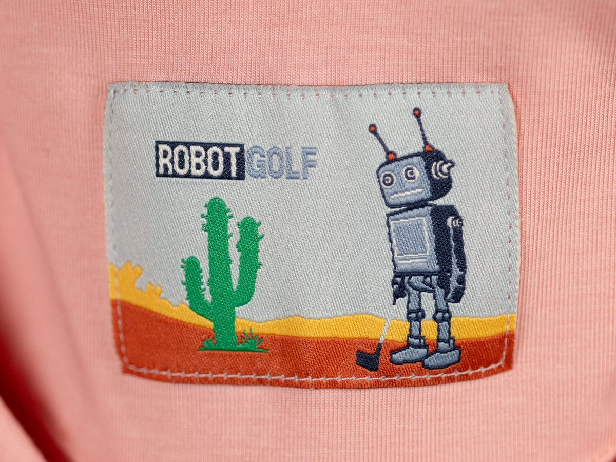 Robot Golf Pink Pony Club polo, lifestyle view.